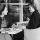 Two ladies lunching at the Lord and Taylor tea room, April 1946, in incredible hats.